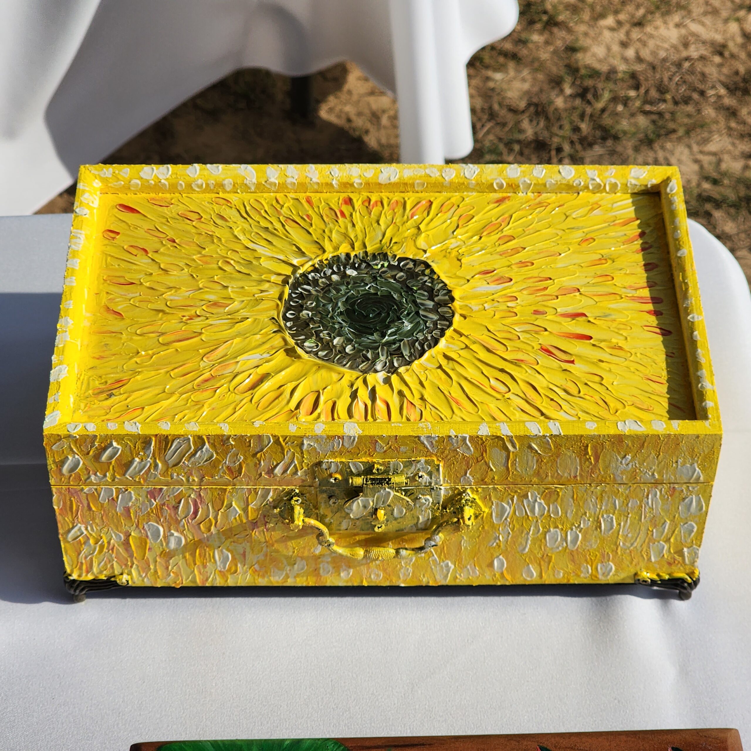 Beautiful handpainted wooden trinket box with a mirror. This cute texturized sunflower trinket box is an ideal gift for a special loved one. You can store jewelry such as rings, necklaces, bracelets, or anything you would like to keep in a particular place, especially in this elegant and artistic trinket box.