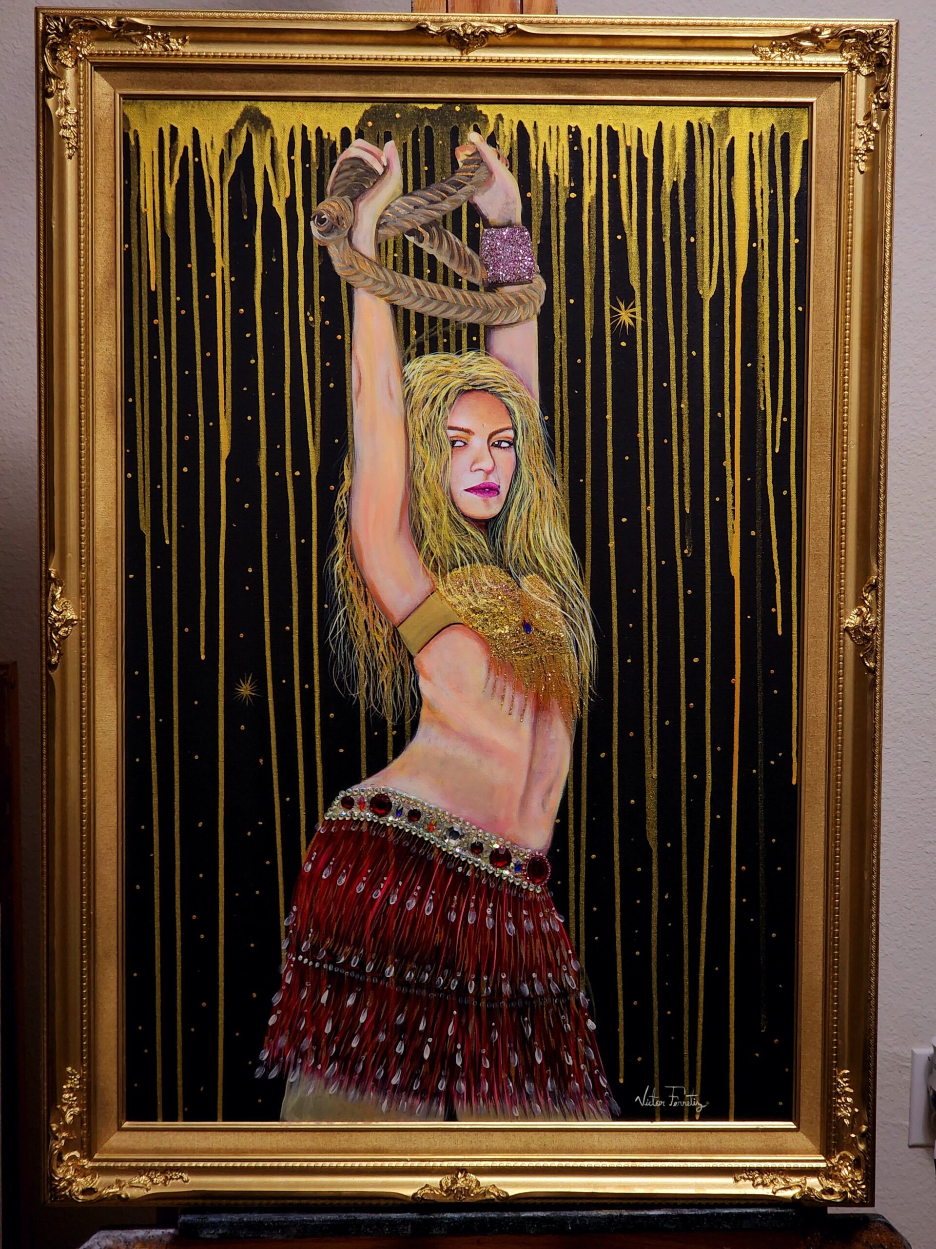 This is a surrealistic portrait of Colombian singer Shakira. The painting was composed with mixed media such as stones, glitter, metallic paint and acrylic paints. Painted wooden frame. Painting size: 24"x36"