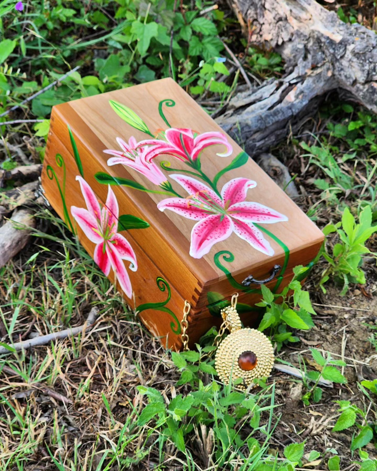 Antique handpainted wooden jewelry box with original design of a Stargazer Lily. This box includes fancy such as brass feet, handle, and a foam ring pad.