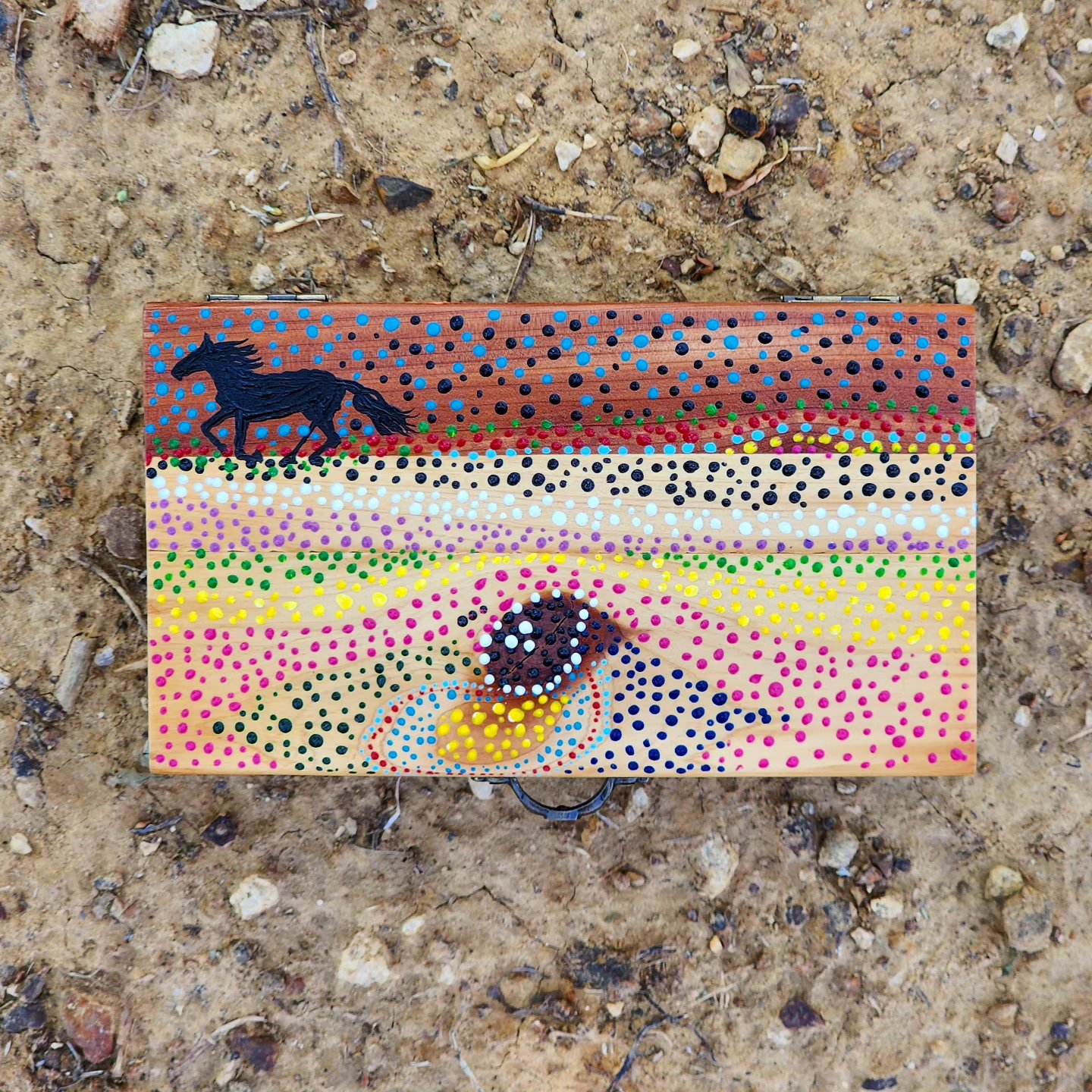 Handpainted wooden trinket box with original design of a horse trotting on a field. The design was executed with an art technique called Pointilism, which consists of forming figures made of dots that create an image from a distance. I added brass feet and an antique brass plated handle, felt, and a pad insert ring.