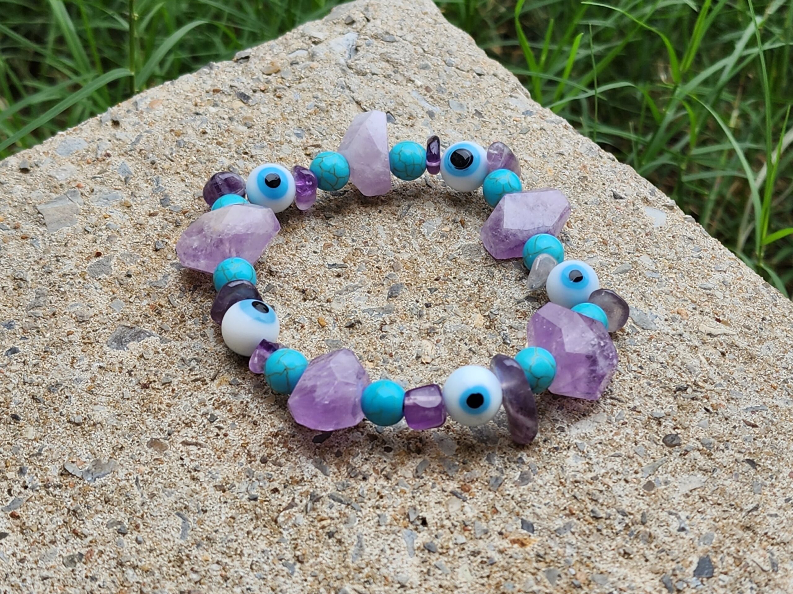Handcrafted bracelets made with amethyst, turquoise, and evil eye beads.