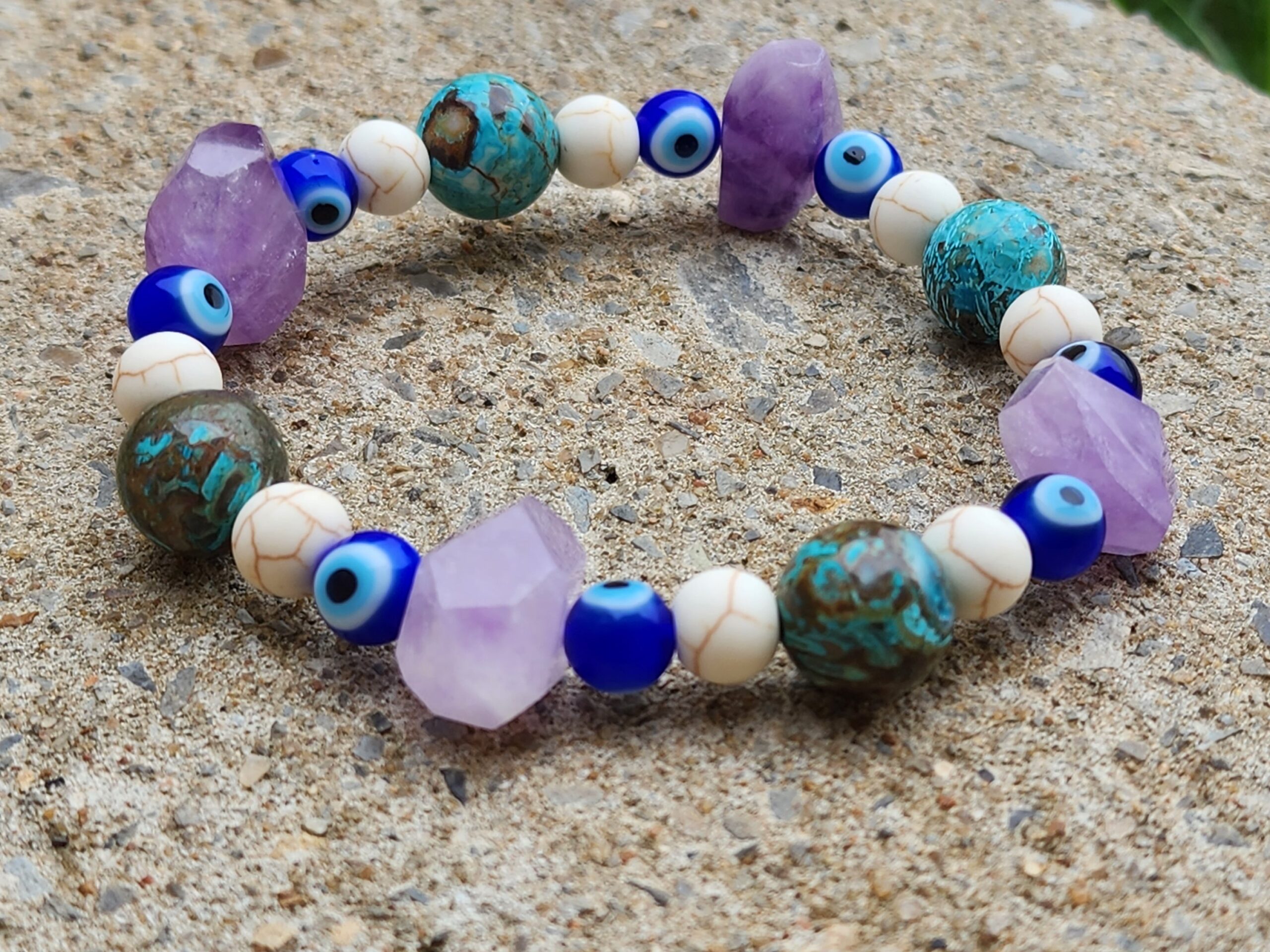 Handcrafted bracelets made with amethyst, turquoise, and evil eye beads.