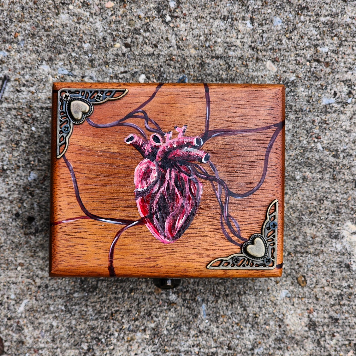 Antique wooden box that was repurposed into this beautiful trinket/jewelry box. I handpainted a creepy-cool anatomical heart with some evil eyes.