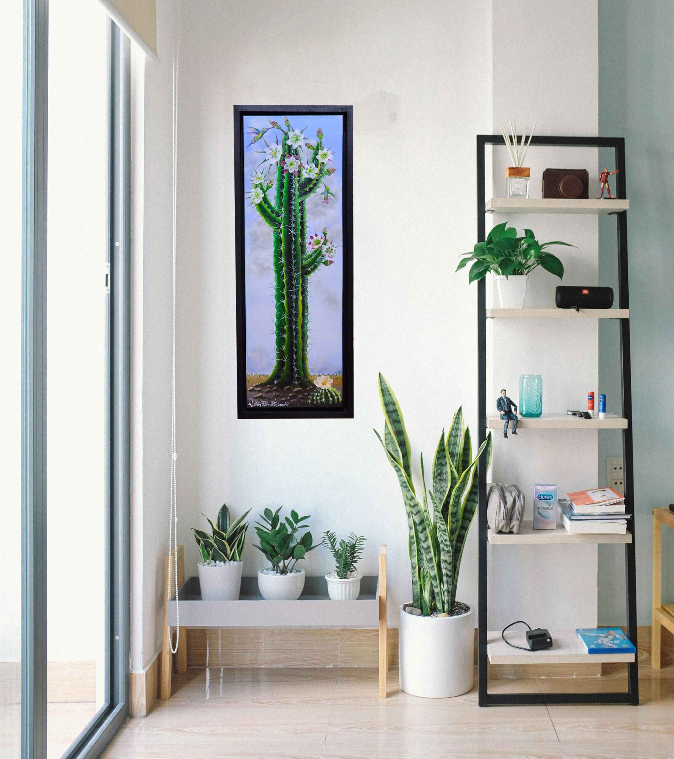 Hummingbirds feeding on a succulent blooming cactus. This work of art has a custom frame handmade with completely resistant, strong poplar wood and is already painted with a uniform black color. The frame already has some D-shaped hooks assembled, ready to hang in your beautiful home.