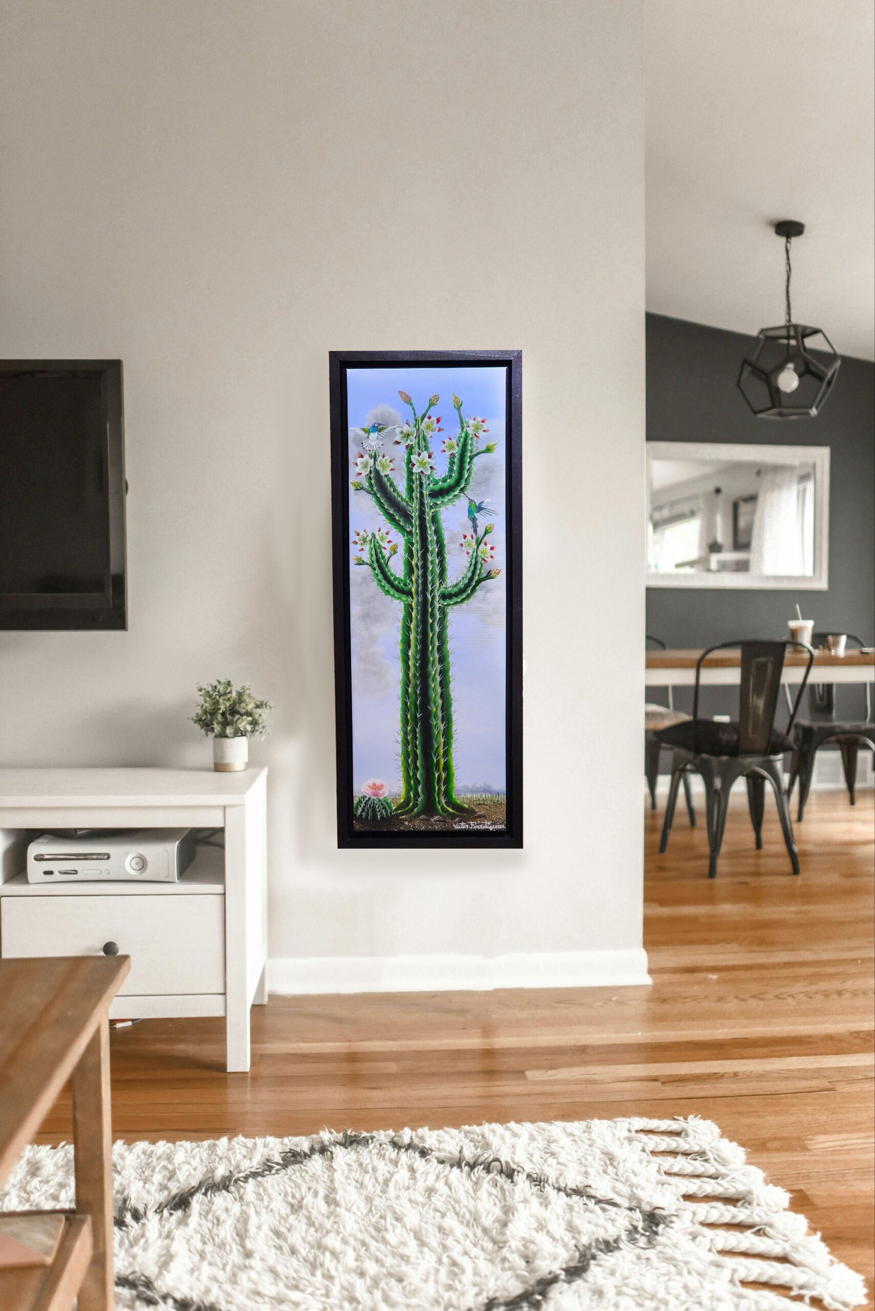 Hummingbirds feeding on a succulent blooming cactus. This work of art has a custom frame handmade with completely resistant, strong poplar wood and is already painted with a uniform black color. The frame already has some D-shaped hooks assembled, ready to hang in your beautiful home.