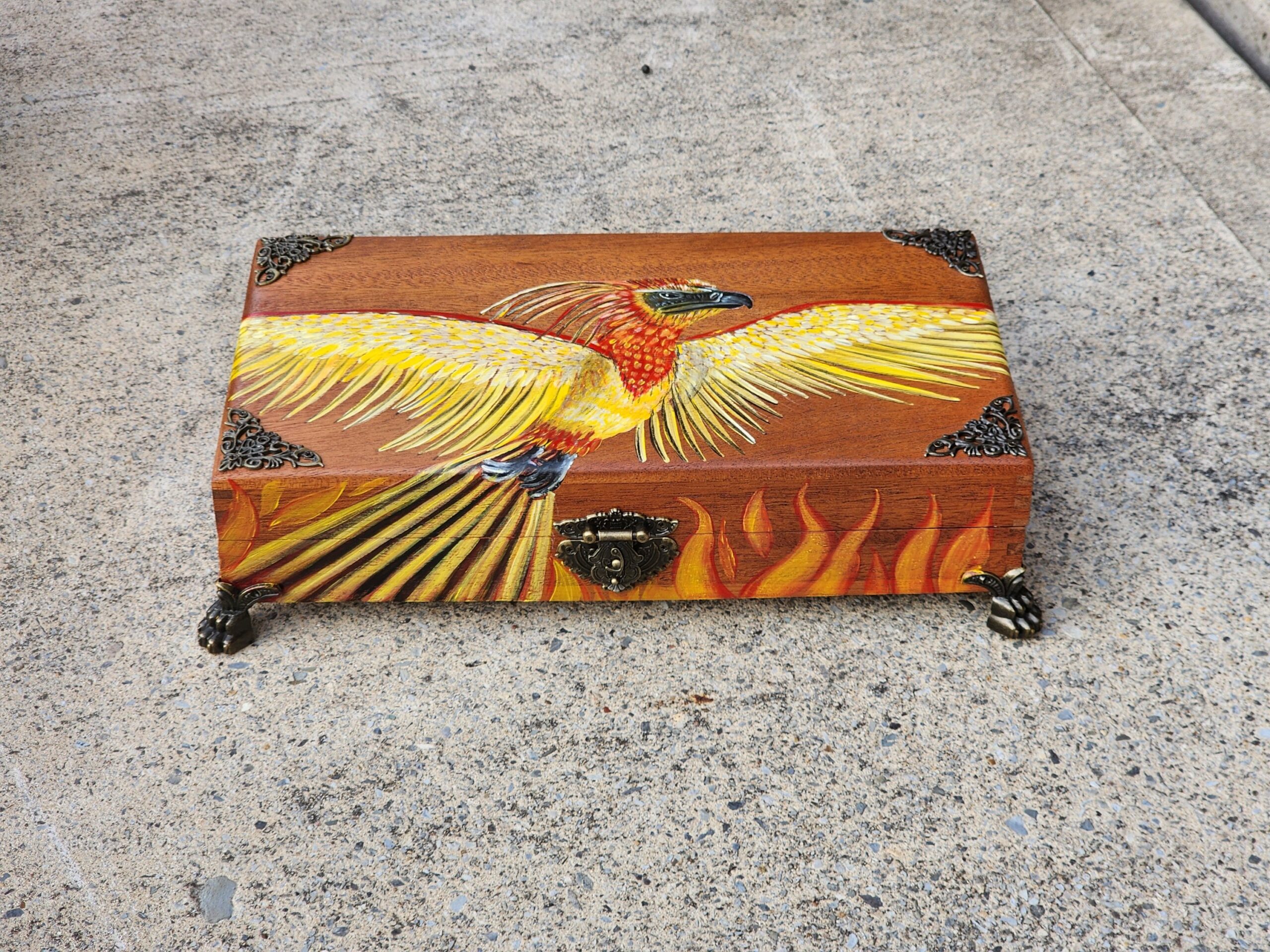 Repurposed antique wooden trinket box into a beautiful jewelry box with a phoenix design rising from the ashes. Foam ring pad insert in the lid and inside. Hardware assembled, definitely one-of-a-kind.