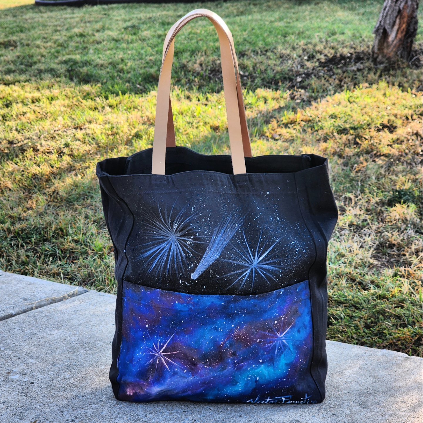 This is a handpainted black tote bag with resistant leather handles. This bag was painted with textile paint on tote fabric. Size: 12x15 inches. Washer and dryer safe.