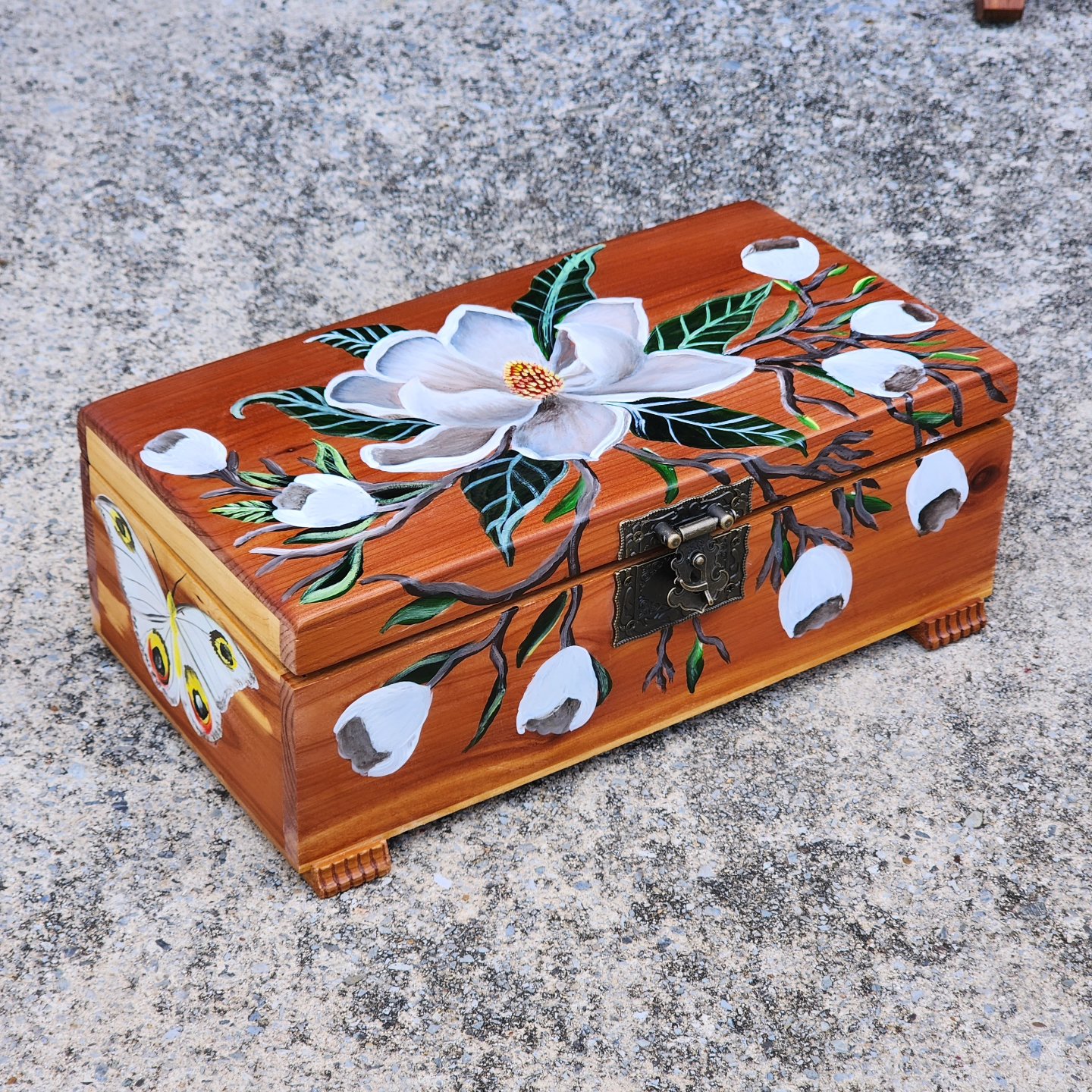 Handpainted antique wooden jewelry box with original design of moths and magnolias. This cute trinket box is an ideal gift for a special loved one. You can store jewelry such as rings, necklaces, bracelets, or anything you would like to keep in a particular place, especially in this elegant and artistic trinket box.