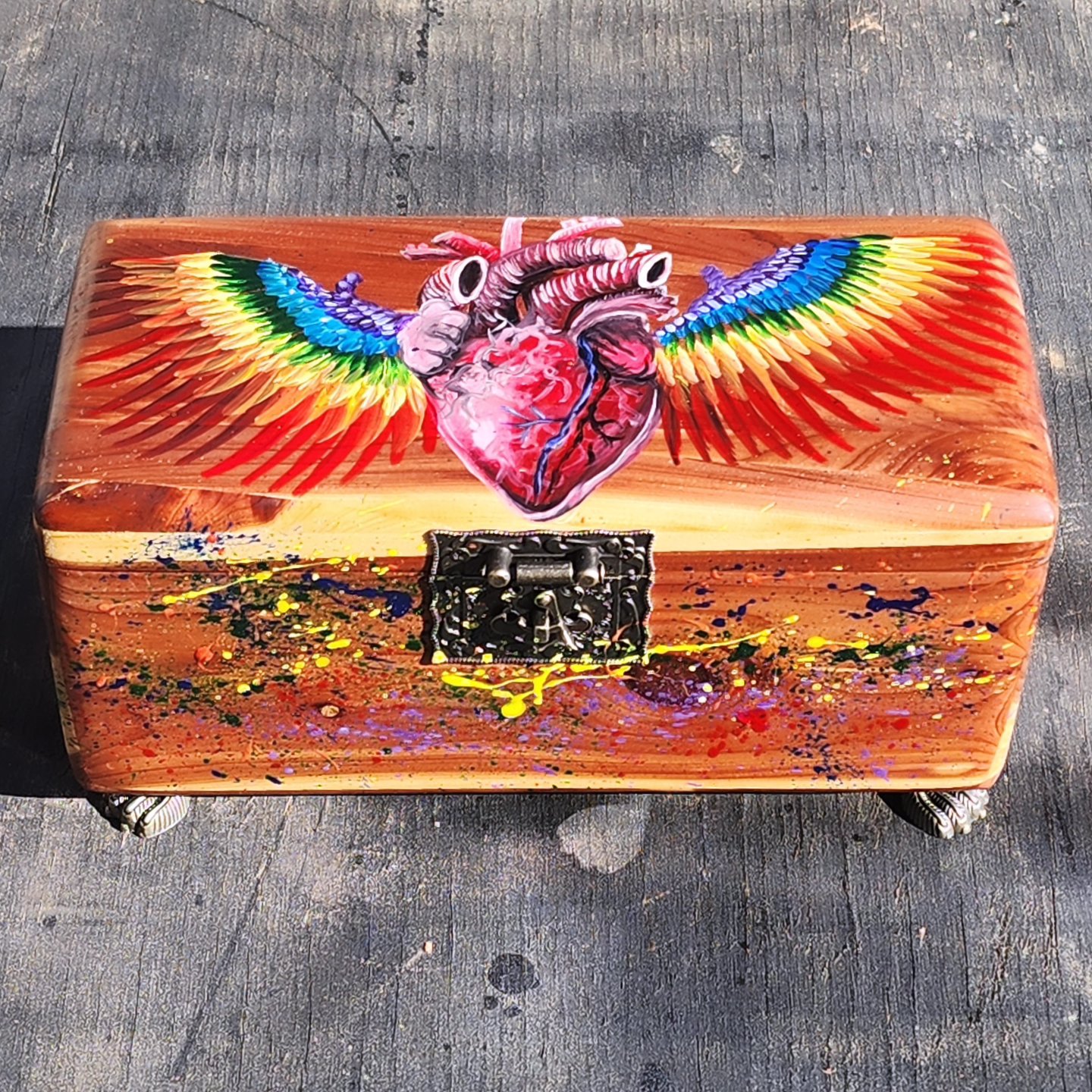 Antique wooden jewelry box with original design of a heart. Dimensions of box in inches: 5 length x 9 width x 4 height.