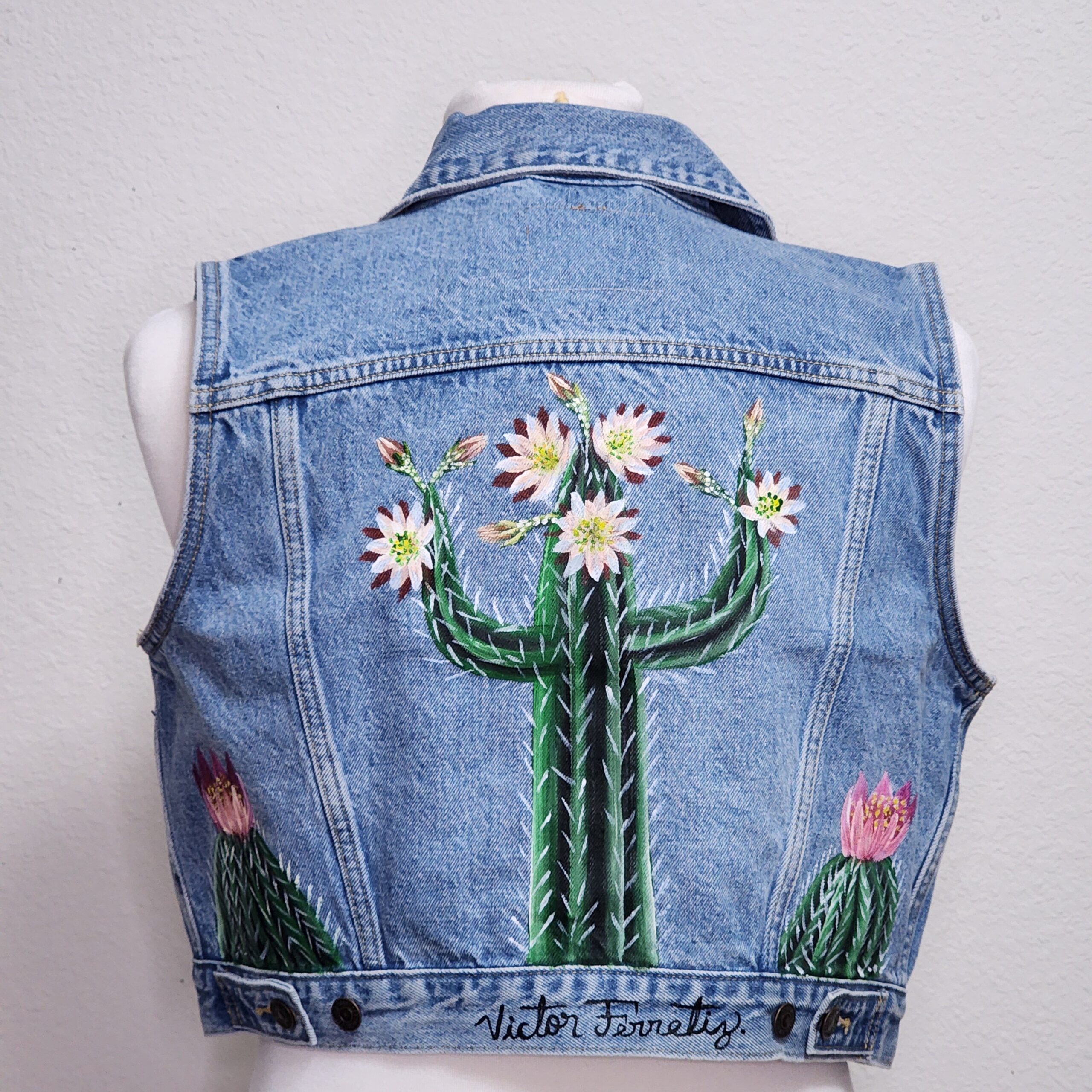 Handpainted brand-new denim vest with textile paint. Washer and dryer safe. Size: women's large