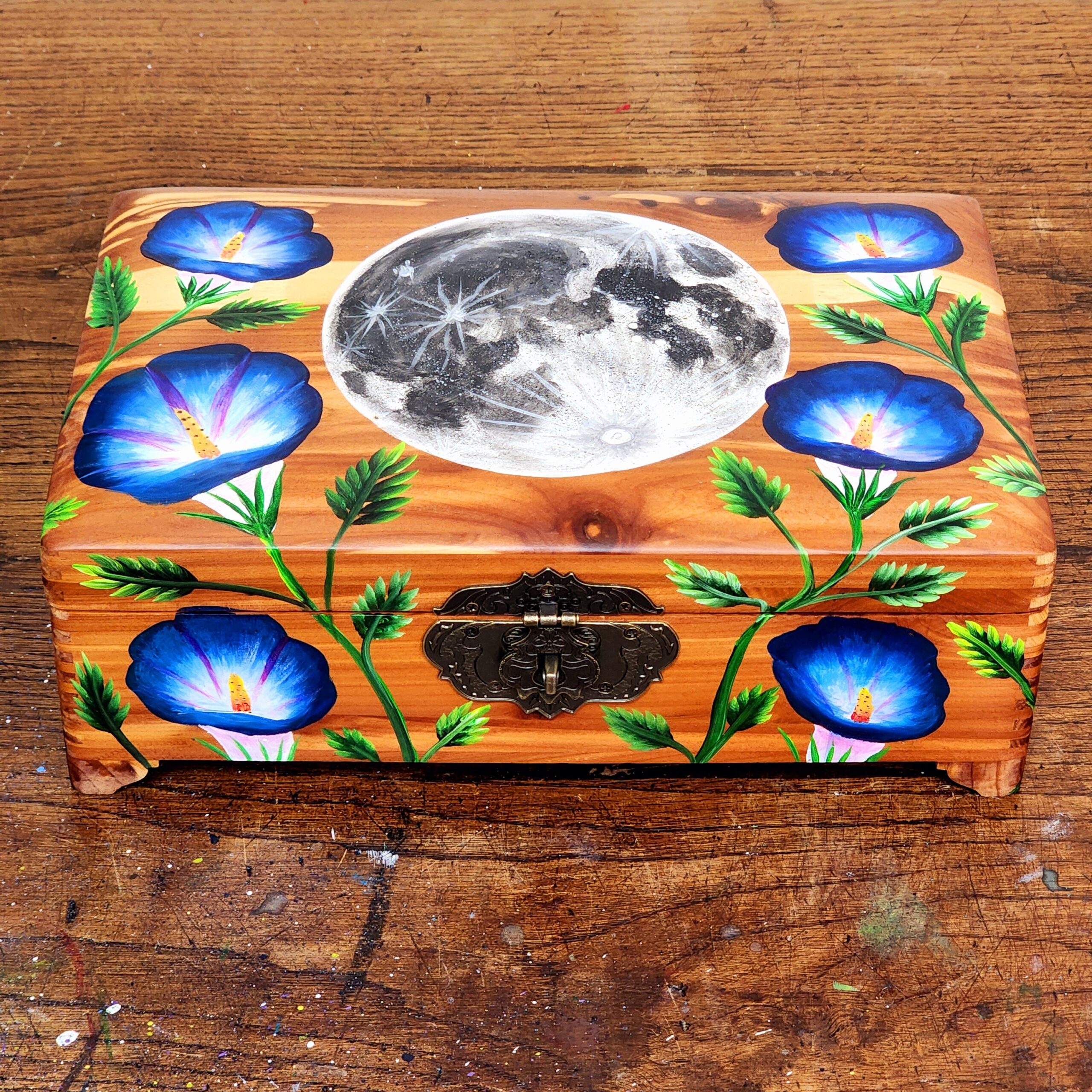 Repurposed antique wooden jewelry box with original design of a moon and morning glories.