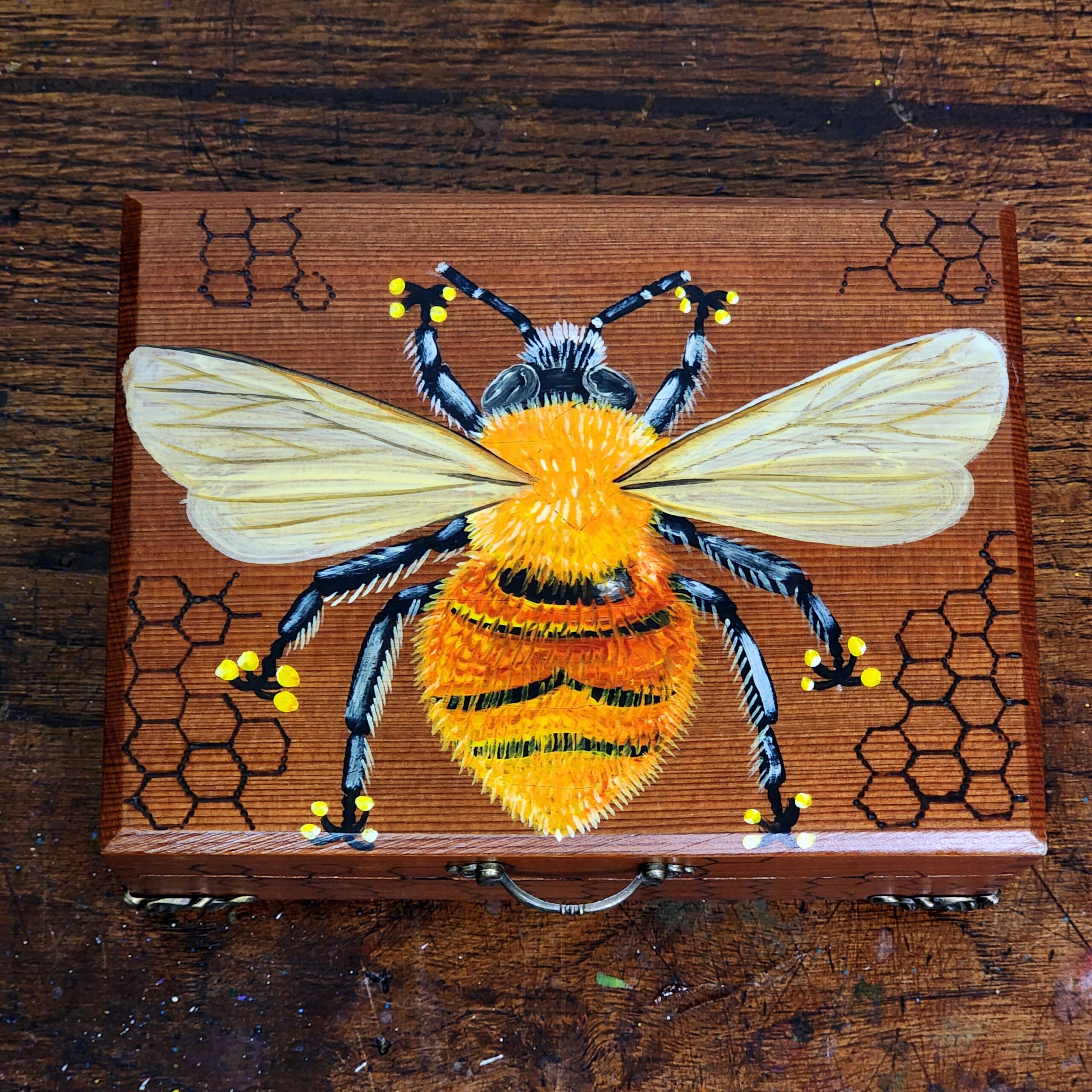 Antique cigar wooden box repurposed into this beautiful jewelry box with a design of a bee with burned honey comb.