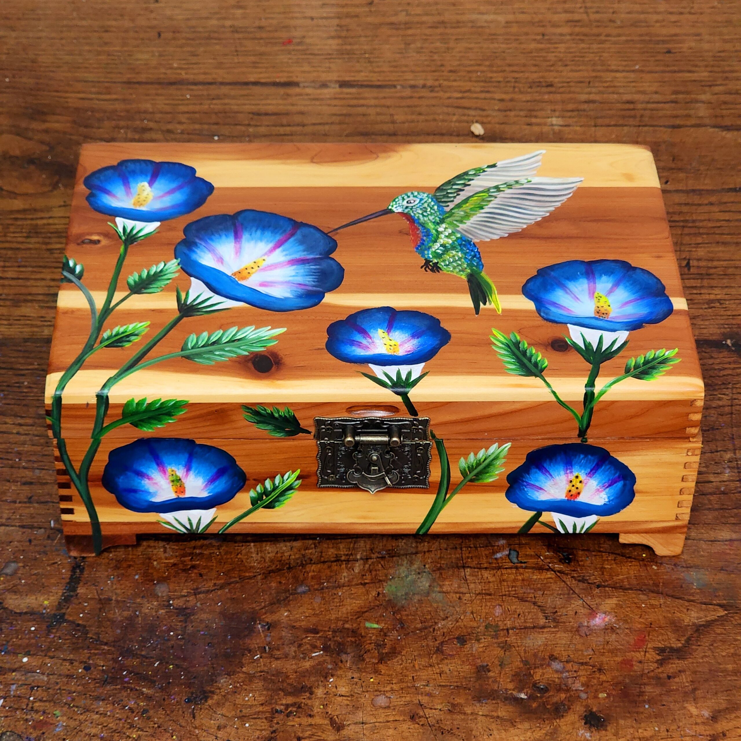 Repurposed antique wooden jewelry box with original design of morning glories and hummingbirds.