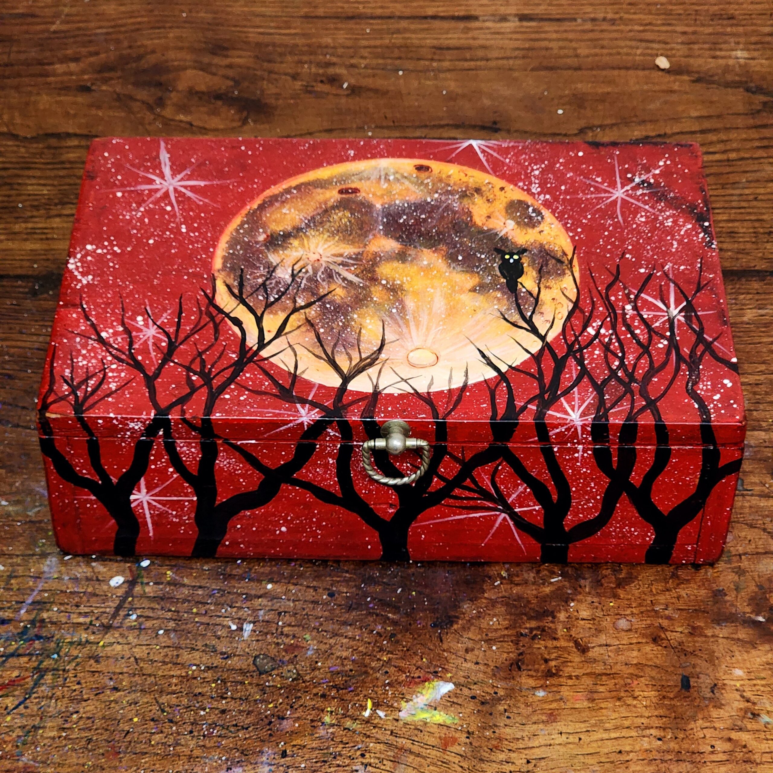 Repurposed antique wooden jewelry box with a design of a blood moon.